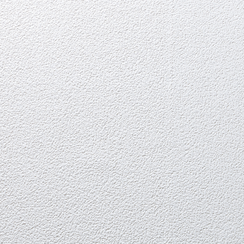 Weiße Wand mit feiner, unregelmäßiger Strukturoberfläche.