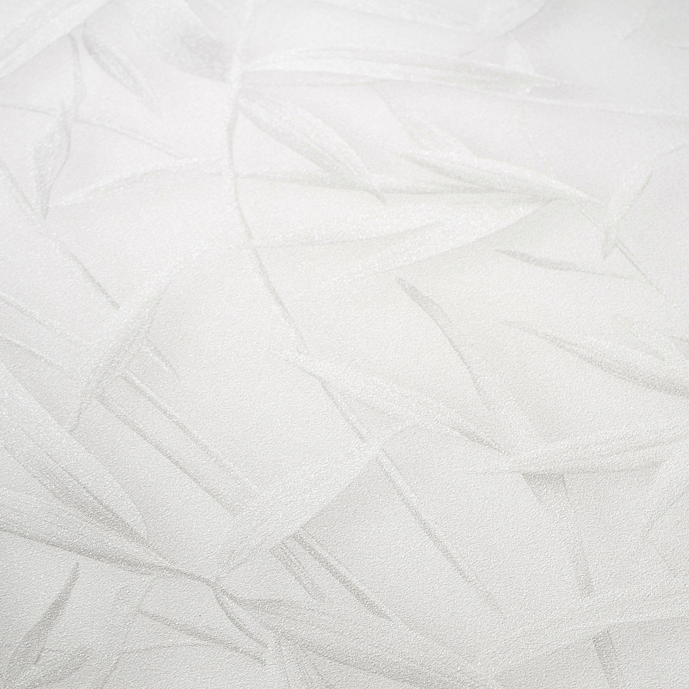 Dezente Vliestapete mit filigranem Gräserdesign